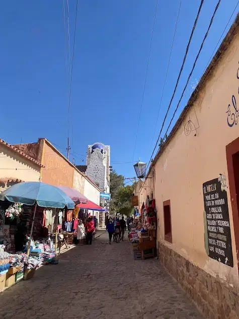 A street in Humahuaca with a view of the church.