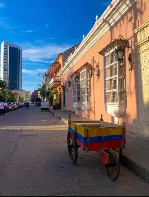 Is Cartagena safe? A street in Cartagena with a cart in the colors of Colombia 