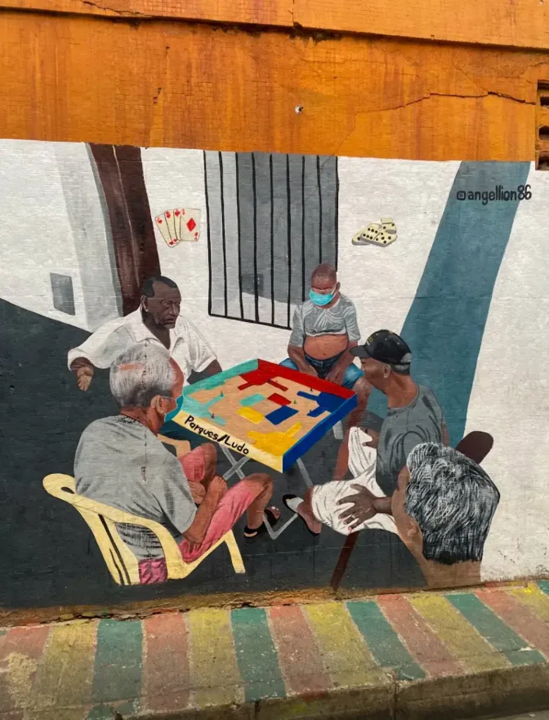 Is Cartagena safe? A painting of 5 local men playing dominos in the streets of Getsemani. 