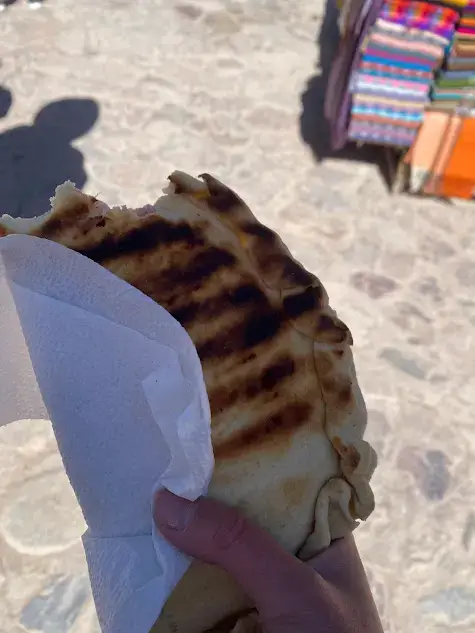 A ham and cheese tortilla rellena on a day trip to Purmamarca